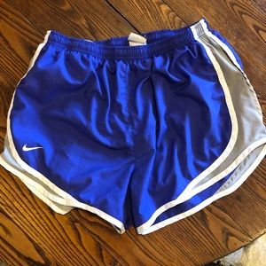 Purple/ blue Nike running shorts.